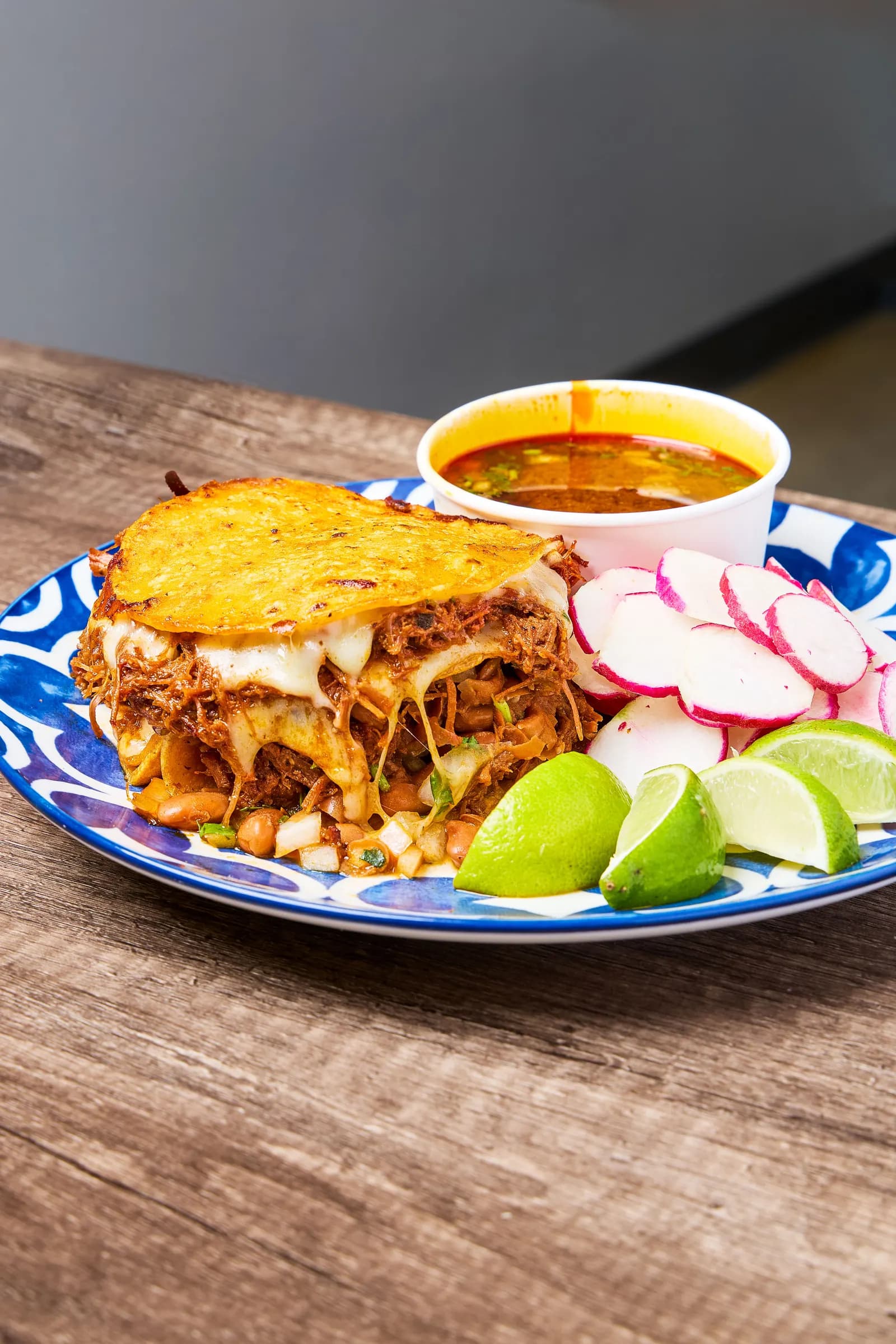Crispy birria quesatacos with consommé at Mr. Birria in Santee