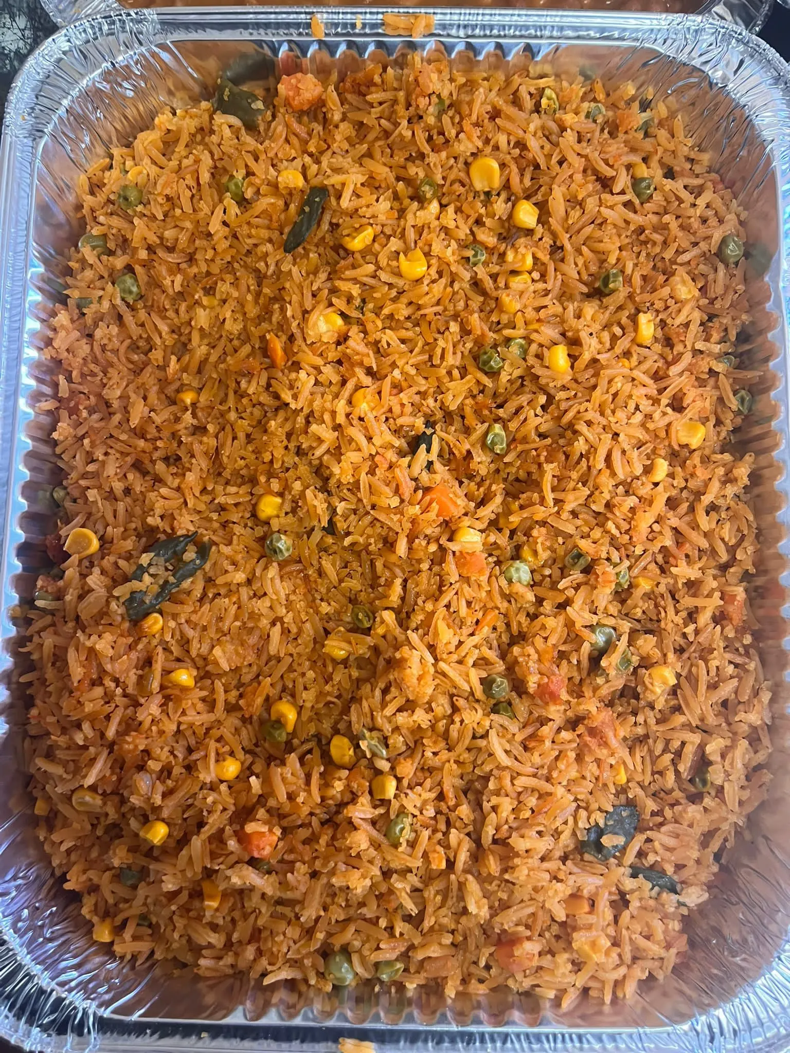 Catering tray of Mexican rice with corn, peas and carrots at Mr. Birria
